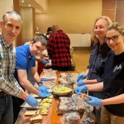 Temple volunteers prepare sandwiches for the Resilience Montreal day shelter.