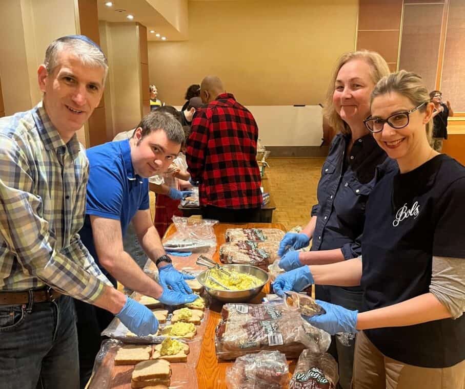 Temple volunteers prepare sandwiches for the Resilience Montreal day shelter.