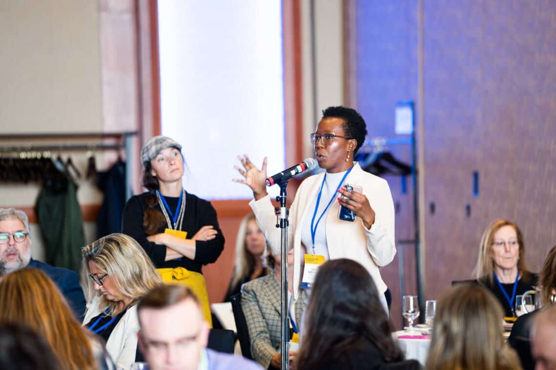 Vicky Mochama, director of communications for Press Forward, speaks at the Charlottetown conference.